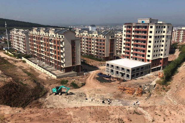 Paleontologist Xu Xing leads a dig next to apartments being constructed in Yanji, China, Sept. 12, 2018.  CHRISTINA LARSON/THE CANADIAN PRESS