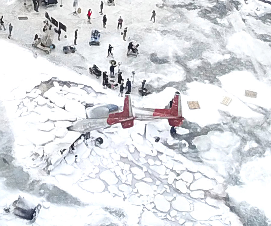 Aerial pictures of Pinewood Studios show what looks to be a crash scene with a plane stuck in snow in an arctic environment. Credit: Splash News