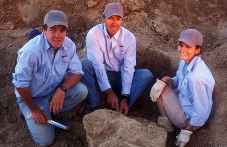 Sandy Mackenzie (left) with parents Stuart and Robyn Mackenzie excavating a thigh bone of Cooper during the 2007 dinosaur dig. Credit: Gary Cranitch